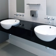 A view of the black polished granite vanity, bathroom, bathroom accessory, bathroom cabinet, bathroom sink, ceramic, countertop, floor, interior design, plumbing fixture, product design, sink, tap, tile, toilet seat, wall, gray, black, white