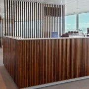 A view of polished timber partitioning screens,some moveable. furniture, product, wall, brown, gray