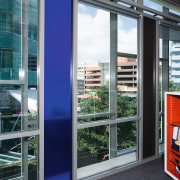 A view of ATCO Steel Devlopments' runs through door, facade, window, gray