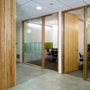 A view of some work done by Cortech architecture, ceiling, door, floor, flooring, glass, interior design, lobby, real estate, wall, wood, gray