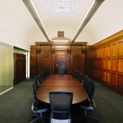 A view of the formal boardroom featuring wood ceiling, conference hall, furniture, interior design, brown, white