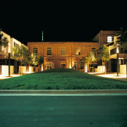 A view of the quality designed apartment complexes architecture, building, estate, facade, home, house, landscape lighting, lighting, mansion, night, property, real estate, residential area, suburb, villa, black