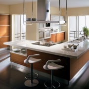 A view of this kitchen featuring teak cabinetry, cabinetry, countertop, cuisine classique, interior design, kitchen, gray