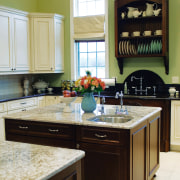 A view of this kitchen featuring tiled flooring, cabinetry, countertop, cuisine classique, hardwood, home, interior design, kitchen, room