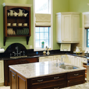 A view of this kitchen featuring tiled flooring, cabinetry, countertop, cuisine classique, furniture, hardwood, home, interior design, kitchen, room, yellow, white