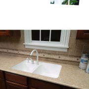 A view of this kitchen featuring granite benchtops bathroom sink, countertop, plumbing fixture, sink, tile, white