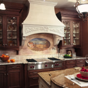 A view of this traditional kitchen featuring Ovation cabinetry, countertop, cuisine classique, home appliance, interior design, kitchen, kitchen appliance, kitchen stove, red, orange