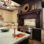 A view of this traditional kitchen featuring Ovation cabinetry, countertop, cuisine classique, interior design, kitchen, black, orange