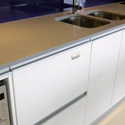 A view of this kitchen featuring the latest countertop, kitchen, major appliance, product, product design, sink, white