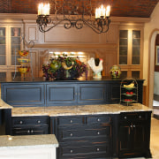 View of this kitchen featuring traditional timber cabinetry, cabinetry, countertop, cuisine classique, furniture, kitchen, room, brown