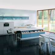 A view of a kitchen by Poggenphol Kitchens. countertop, interior design, kitchen, room, table, window, white, black
