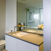 A view of the bathroom featuring  frameless architecture, bathroom, countertop, interior design, kitchen, room, sink, gray