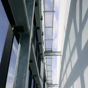 A view of the structural steel manufactured and architecture, building, daylighting, daytime, facade, glass, line, steel, structure, window, gray, black, white