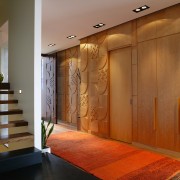 A view of the internal living areas featuring ceiling, door, floor, flooring, hardwood, interior design, lobby, wall, wood, wood flooring, wood stain, brown