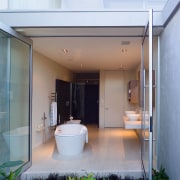 A view of the master bathroom from the architecture, ceiling, courtyard, daylighting, facade, home, house, interior design, real estate, window, white