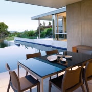 A view of the indoor and outdoor flow architecture, chair, dining room, furniture, house, interior design, real estate, table, window, gray, brown