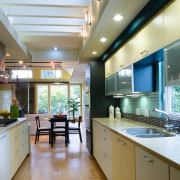 A view of this modern kitchen designed by ceiling, countertop, interior design, kitchen, real estate