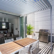 A view of the outdoor entertaing and BBQ balcony, ceiling, daylighting, house, interior design, real estate, roof, window, window covering, gray, white