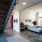 A view of the living area featuring white architecture, ceiling, floor, house, interior design, living room, loft, gray