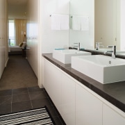 A view of some cabinetry by Trademark Kitchens. architecture, bathroom, countertop, floor, interior design, kitchen, room, sink, tile, gray