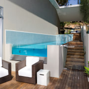A view of a home developed by Lend architecture, furniture, house, interior design, property, swimming pool, table, gray