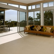 A view of some floor tiles from Impressa door, estate, floor, flooring, hardwood, house, interior design, living room, property, real estate, window, wood flooring, brown, gray