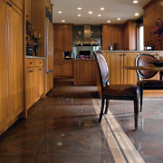 A view of the kitchen an liing areas ceiling, countertop, floor, flooring, hardwood, home, interior design, kitchen, laminate flooring, lighting, lobby, room, tile, wood, wood flooring, brown, gray