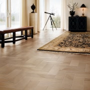 A view of the kitchen an liing areas floor, flooring, hardwood, interior design, laminate flooring, living room, tile, wood, wood flooring, brown, gray