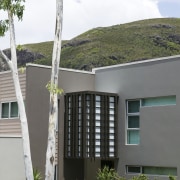 A view of some balustrades from Aluminium Balustrades. architecture, building, condominium, facade, home, house, plant, property, real estate, residential area, tree, window, gray, white