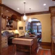 A view of this kitchen features cabinets by cabinetry, ceiling, countertop, cuisine classique, estate, home, interior design, kitchen, real estate, room, brown, red