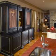 A view of this kitchen designed by Mcfarlane cabinetry, countertop, flooring, furniture, interior design, kitchen, living room, room, brown, black