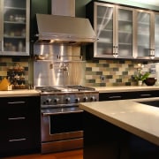 View of this kitchen featuring stained timber flooring, cabinetry, countertop, cuisine classique, interior design, kitchen, room, black