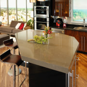 A view of this kitchen featuring quatrsz benchtops, countertop, dining room, floor, flooring, furniture, hardwood, interior design, kitchen, table, wood flooring, brown