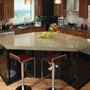 A view of this kitchen featuring quatrsz benchtops, countertop, floor, flooring, furniture, hardwood, interior design, kitchen, table, brown, black