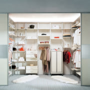 A view of a wordrobe by Innovative Interiors. closet, furniture, interior design, product design, room, shelf, shelving, wardrobe, white, gray