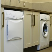 A view of some laundry appliances from Whirlpool. clothes dryer, home appliance, laundry, laundry room, major appliance, product, product design, room, washing machine, gray, brown