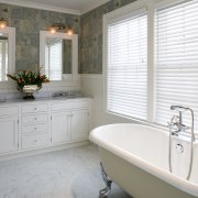 A view of a master ensuite, tiled floor bathroom, bathroom accessory, bathroom cabinet, floor, flooring, home, interior design, real estate, room, sink, tile, wall, window, window covering, window treatment, white, gray