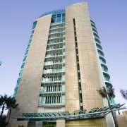 A view of the sandstone stepping stones, sandstone apartment, architecture, building, commercial building, condominium, corporate headquarters, daytime, estate, facade, headquarters, hotel, landmark, metropolis, metropolitan area, mixed use, real estate, residential area, sky, skyscraper, tower block, blue, gray