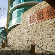 A view of the sandstone stepping stones, sandstone architecture, brick, brickwork, building, facade, sky, wall, window, black