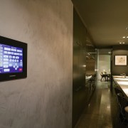 A view of a touch screen, grey walls. ceiling, interior design, brown, gray