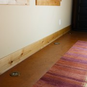 A view of the brass vents  that floor, flooring, hardwood, home, house, interior design, laminate flooring, plywood, room, table, tile, wall, wood, wood flooring, wood stain, brown