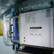 A view of a hi-velocity HVAC system with machine, gray, black