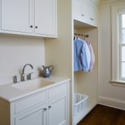 A view of this laundry featuring white timber bathroom, bathroom accessory, bathroom cabinet, cabinetry, countertop, floor, home, interior design, kitchen, laundry room, real estate, room, sink, wall, window, wood, gray