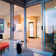 A view of this urban residential building implemented ceiling, door, interior design, living room, real estate, room, window, gray