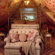 A view of this attic bedroom featuring an bed, bedroom, furniture, home, house, interior design, living room, room, textile, wall, brown, red, orange