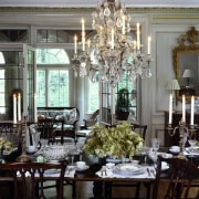 A view of the dining room featuring glittering centrepiece, chandelier, decor, dining room, floristry, flower, function hall, furniture, home, interior design, light fixture, living room, room, table, window, gray, black