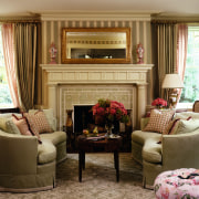 A view of this living area featuring curved chair, couch, curtain, furniture, hearth, home, interior design, living room, room, window, window covering, window treatment, brown