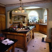 A view of the kitchen featuring tiled flooring, countertop, cuisine classique, estate, interior design, kitchen, room, brown, black