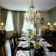 A view of the dining room featuring glittering ceiling, chandelier, decor, dining room, furniture, home, house, interior design, living room, restaurant, room, table, window, gray, brown