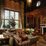 A view of the wood pannelled library/family room home, interior design, living room, lobby, room, window, wood, black, brown